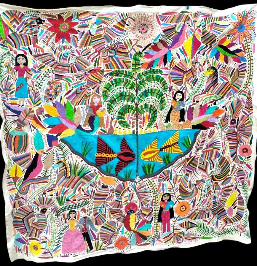 Extra large Otomi tapestry wall art hand-embroidered in Mexico, featuring mermaids, a large palm tree and colorful wildlife.