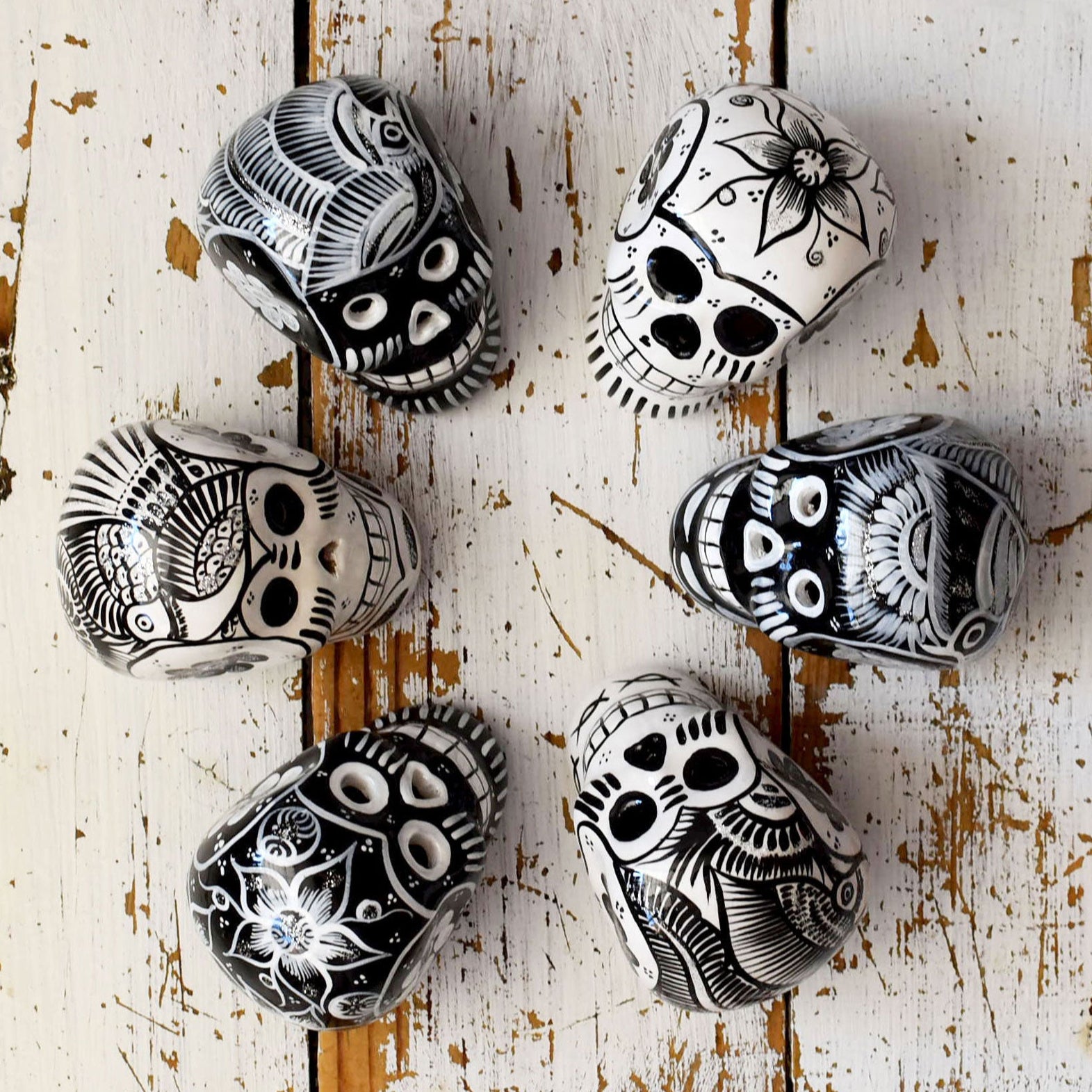 black and white ceramic skulls Dia de Muerto decorations