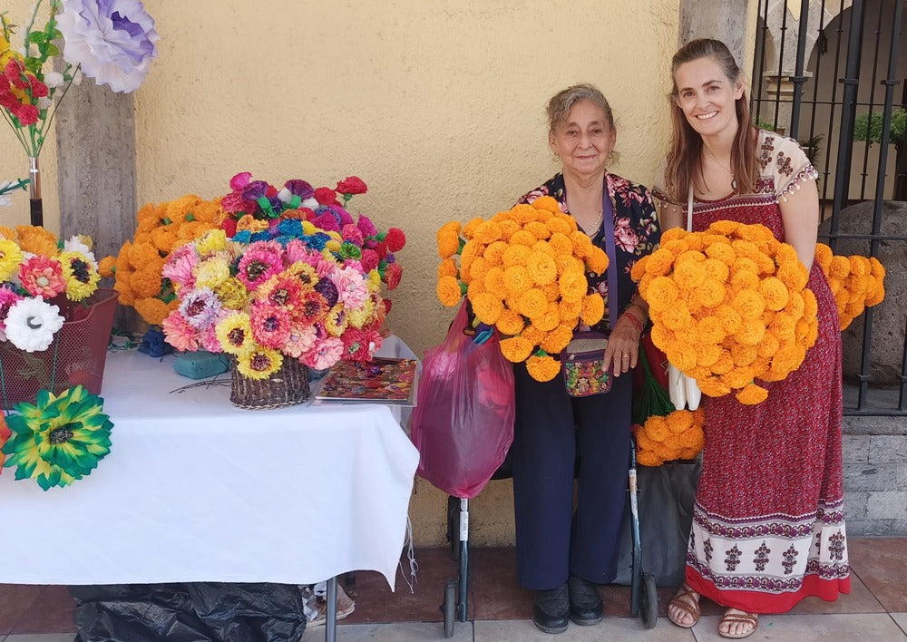 Aprylle and Flower Artist Carmencita holding paper Marigolds Cempasuchil Day of the Dead flowers 