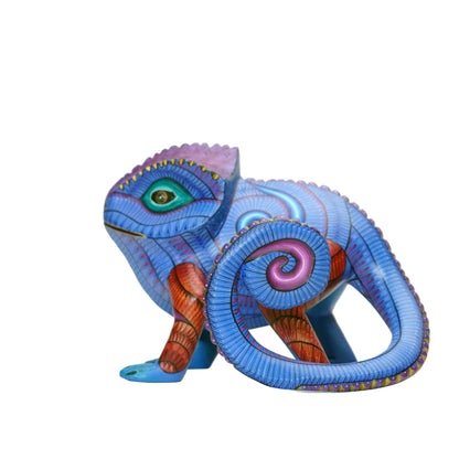 Colorful chamelion figurine with detailed design on a white background. Mexican alebrije.