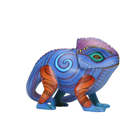 Colorful wooden lizard figurine on a white background