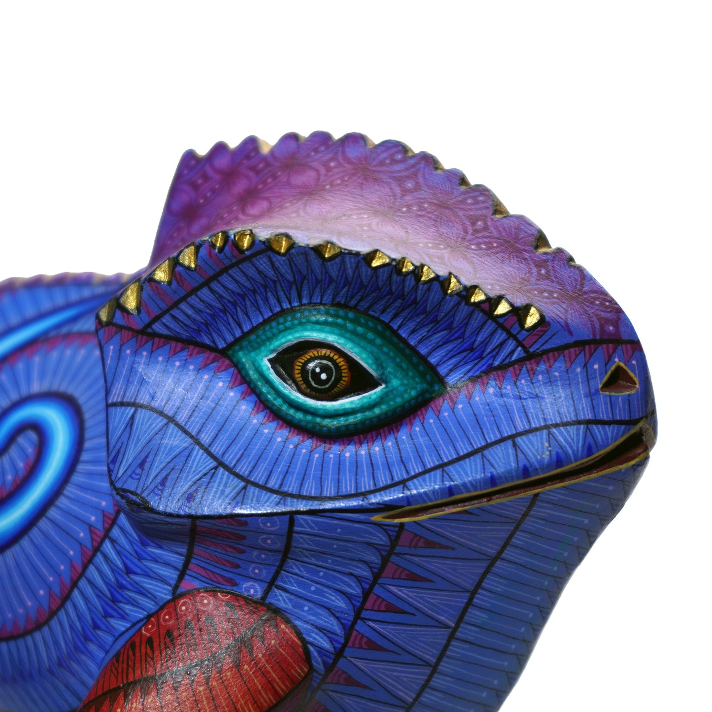 Colourful wooden art piece dragon-like creature with a large eye on a white background. Hand-painted collectable with intricate details.