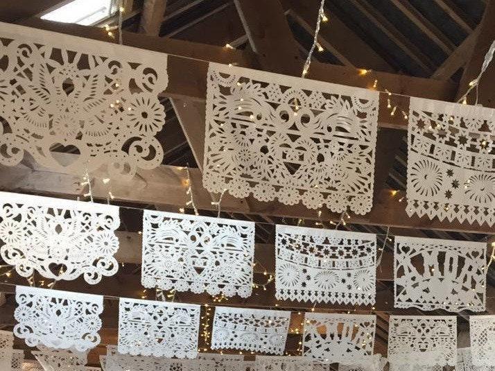 White Wedding Garland Papel Picado Banner Mexican Traditional Heritage Design Waterproof Outdoor Wedding Venue Perfect Ceremony Backdrop Authentic Handmade Flags Intricate Cutout Pattern Beautiful Hanging Display Rustic Bohemian Celebration