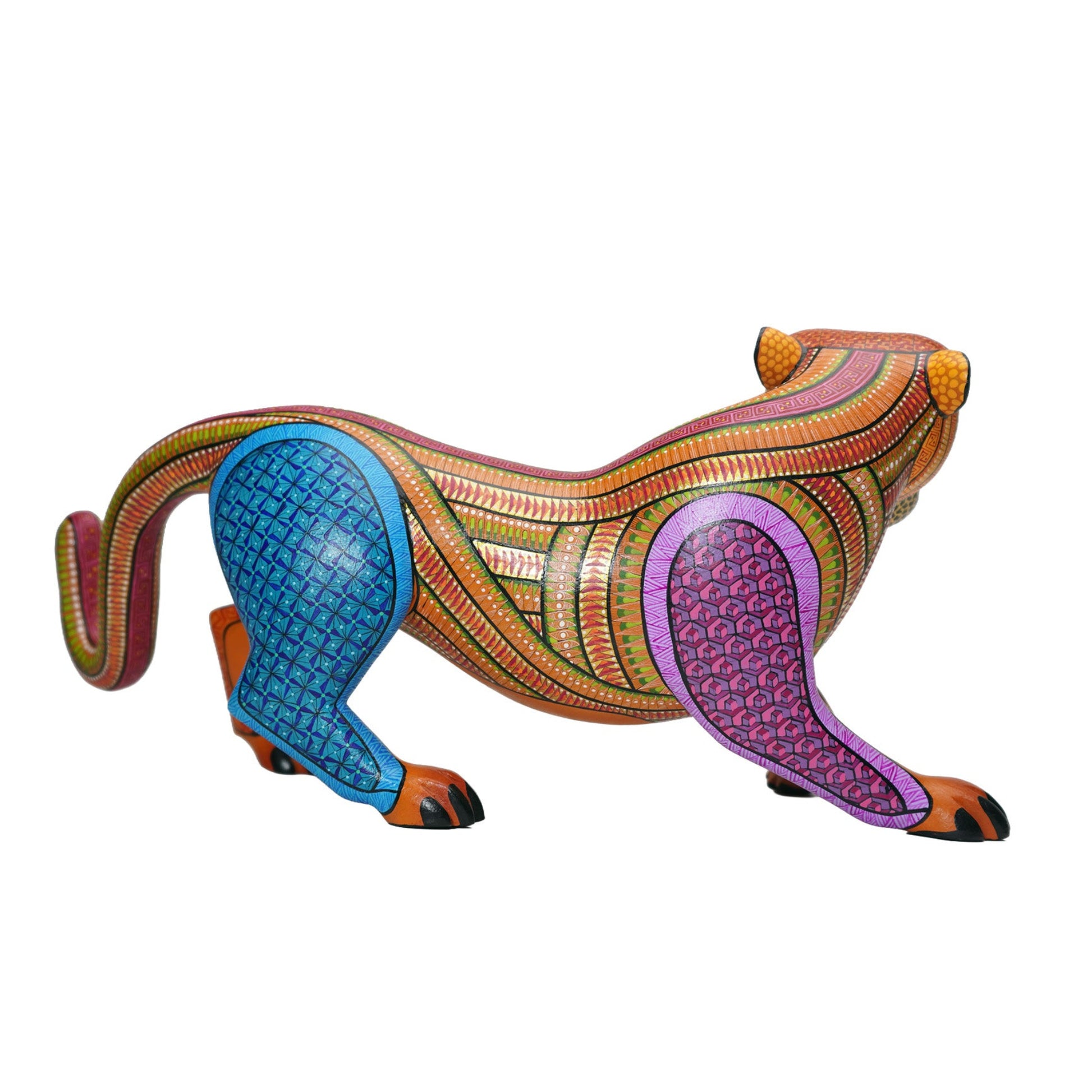 Colourful alebrije jaguar sculpture, with intricate hand-painted patterns, on a white background.