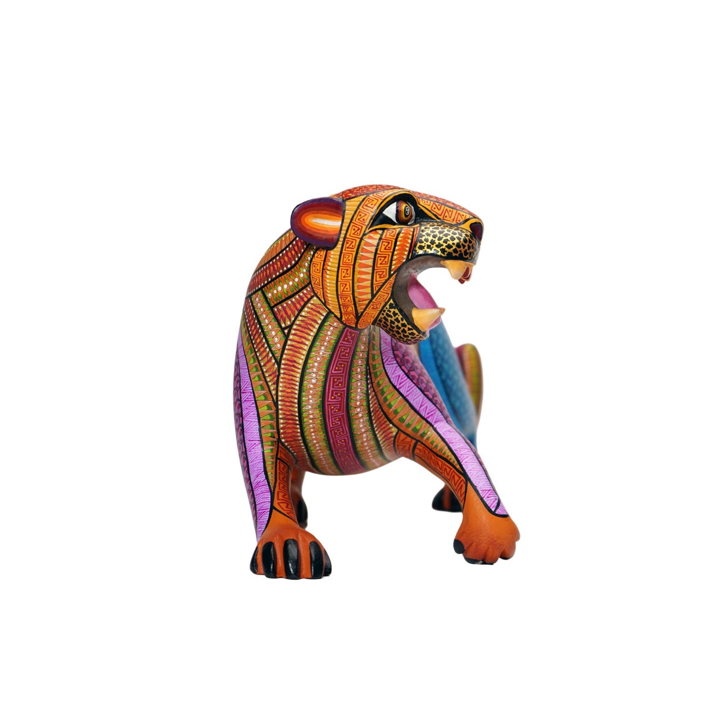 Colourful alebrije jaguar sculpture, with intricate hand-painted patterns, on a white background.