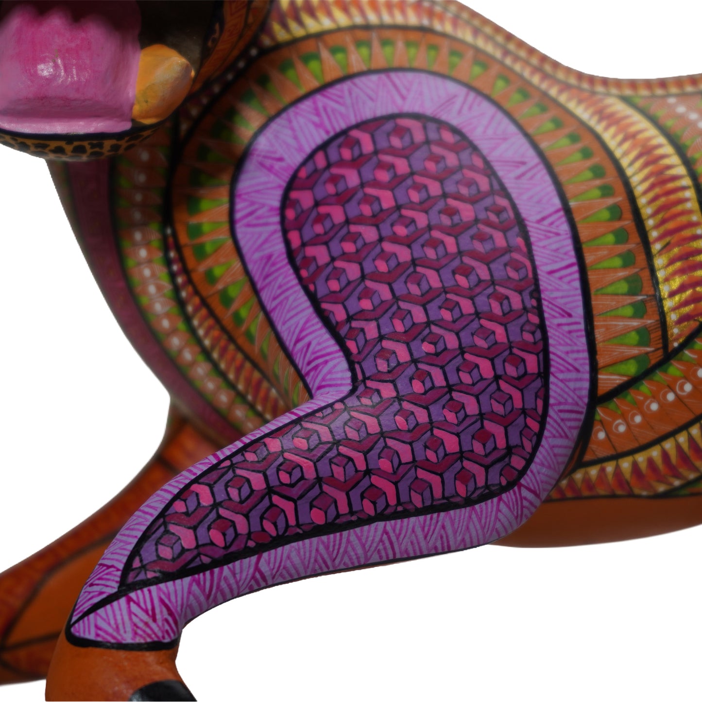 Colourful alebrije jaguar sculpture, close up, with intricate hand-painted patterns, on a white background.