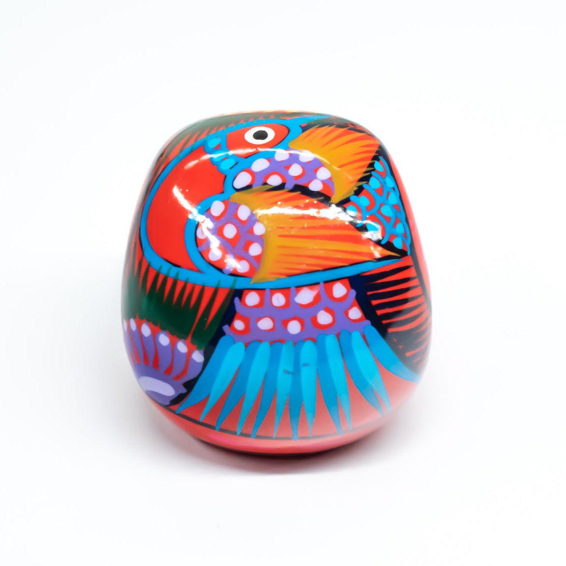 Colourful red skull with hand-painted design, on a white background