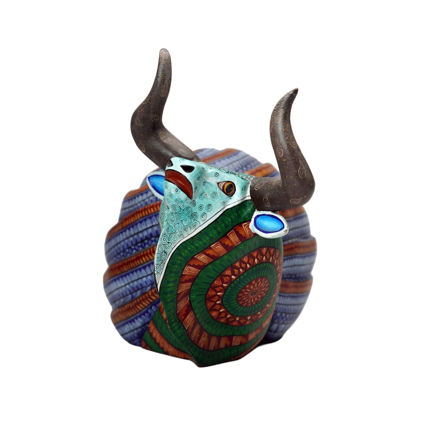 Decorative wood carving with bull design on a white background