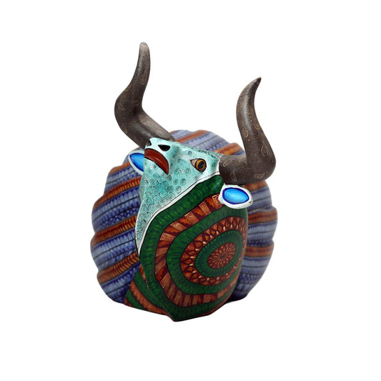 Decorative wood carving with bull design on a white background