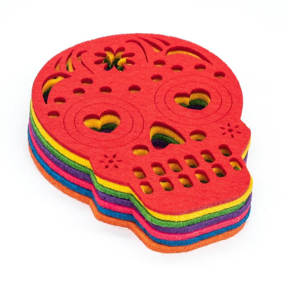 set of 7 differently coloured skull shaped drinks coasters in a pile
