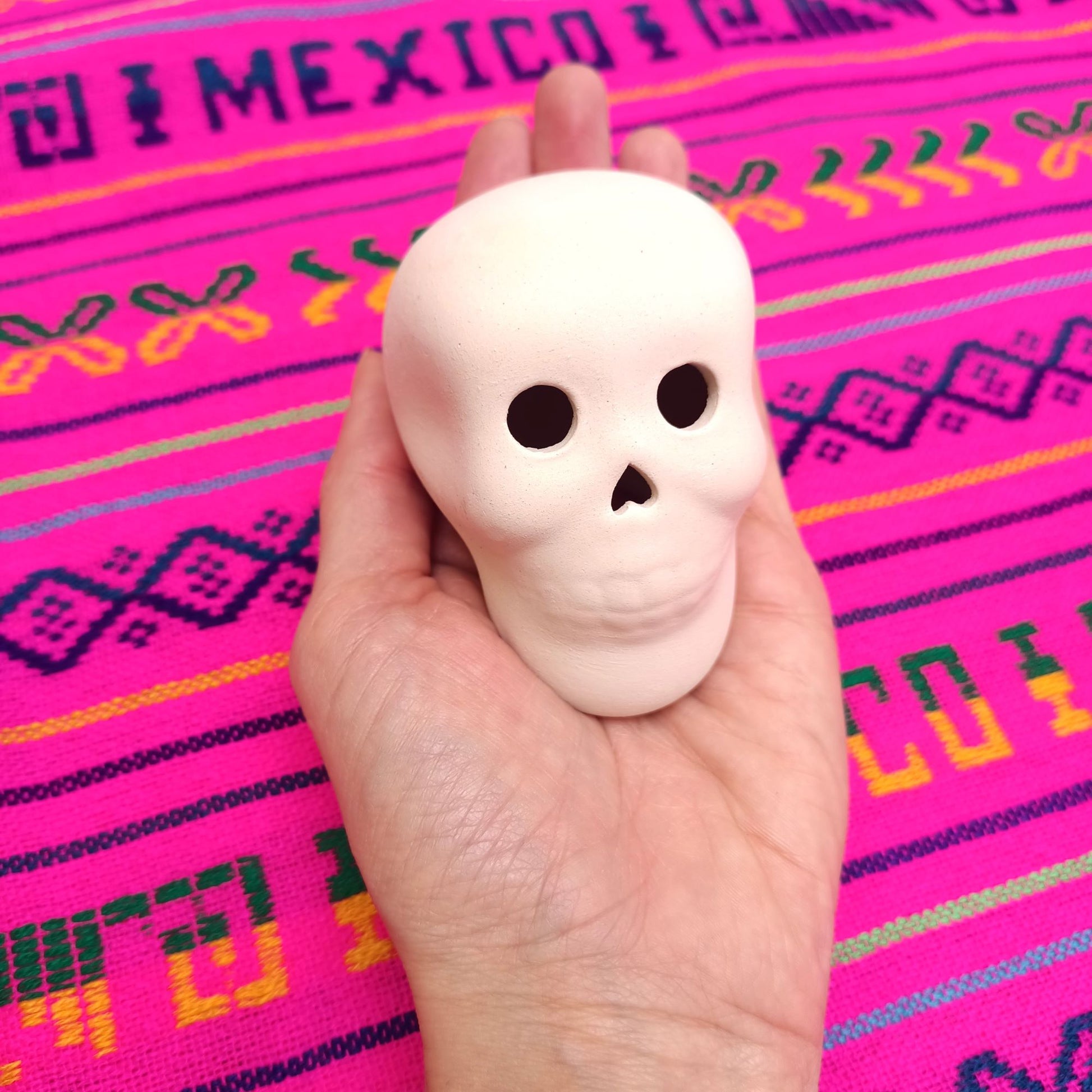 ceramic sugar skulls to paint, fits in hand
